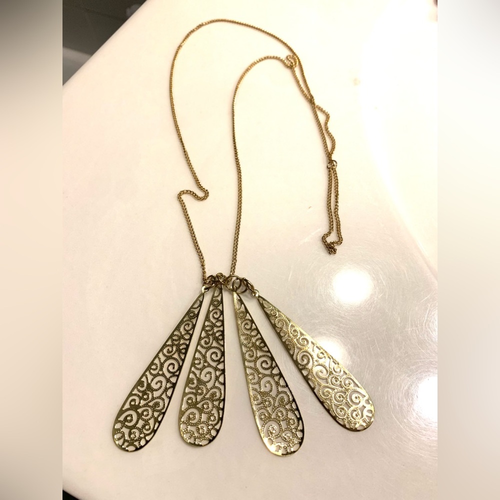 Fashion Gold Pendant and Chain. New W/o tag. four elongated panels Light weight
